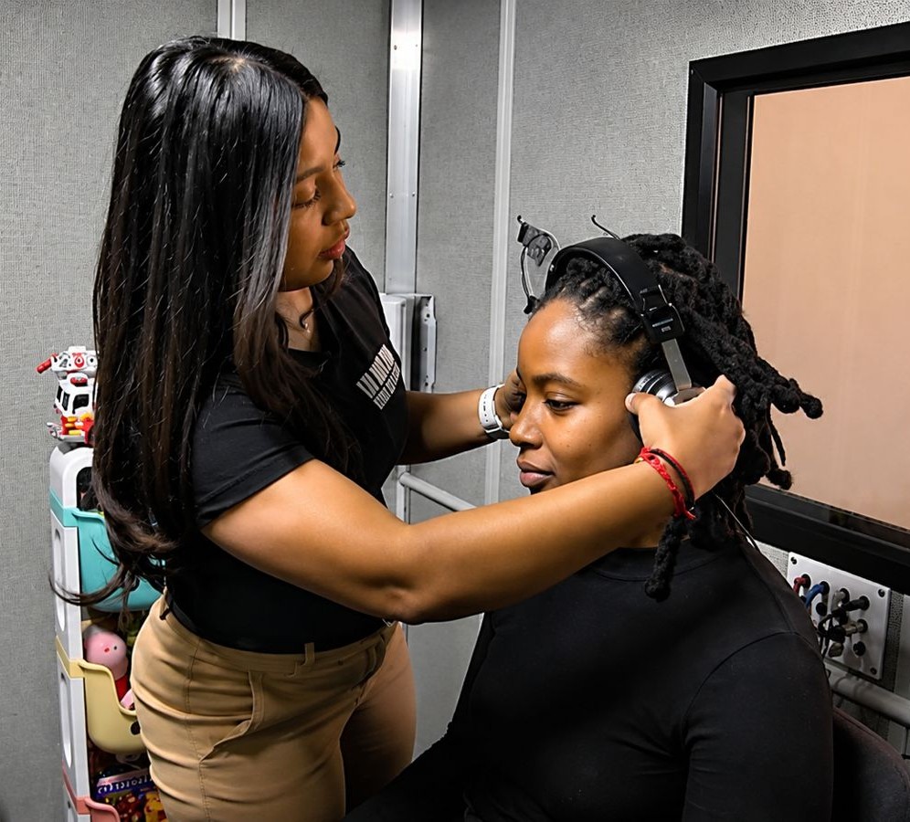 A Lifetime Audiology audiologist conducting a hearing test with a patient